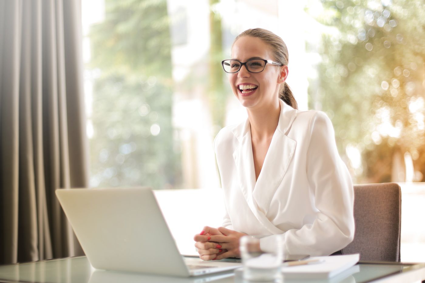 Studio presenting a branded client website on a laptop