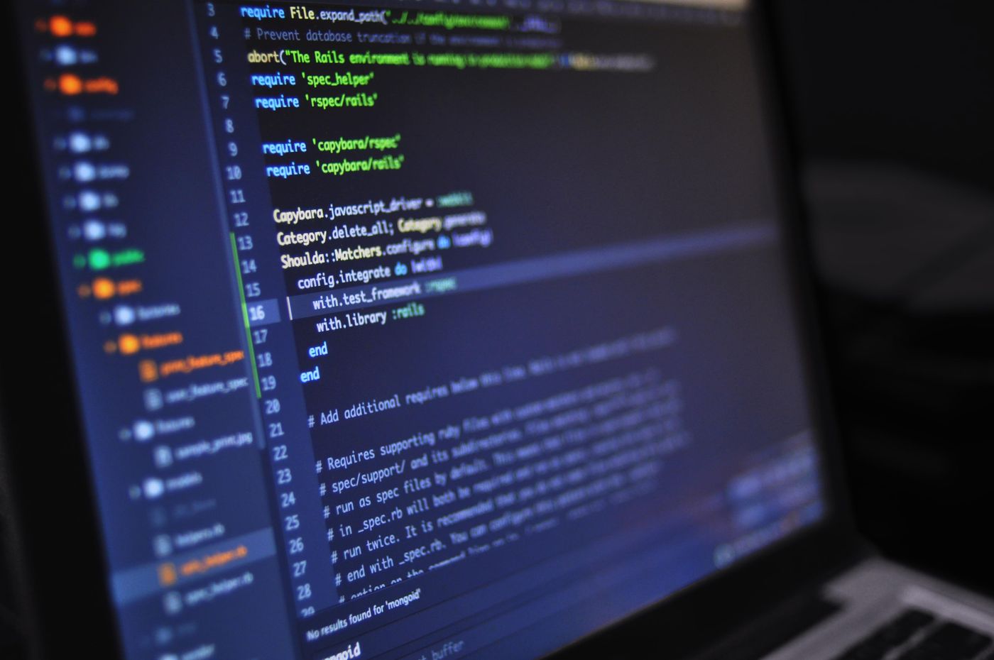 Developer working at a desk with a laptop
