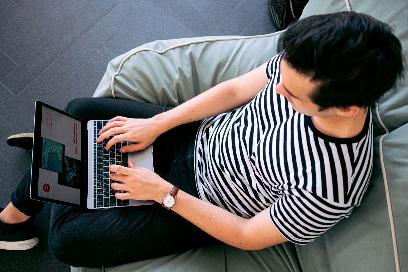 Person working on a laptop while managing a website