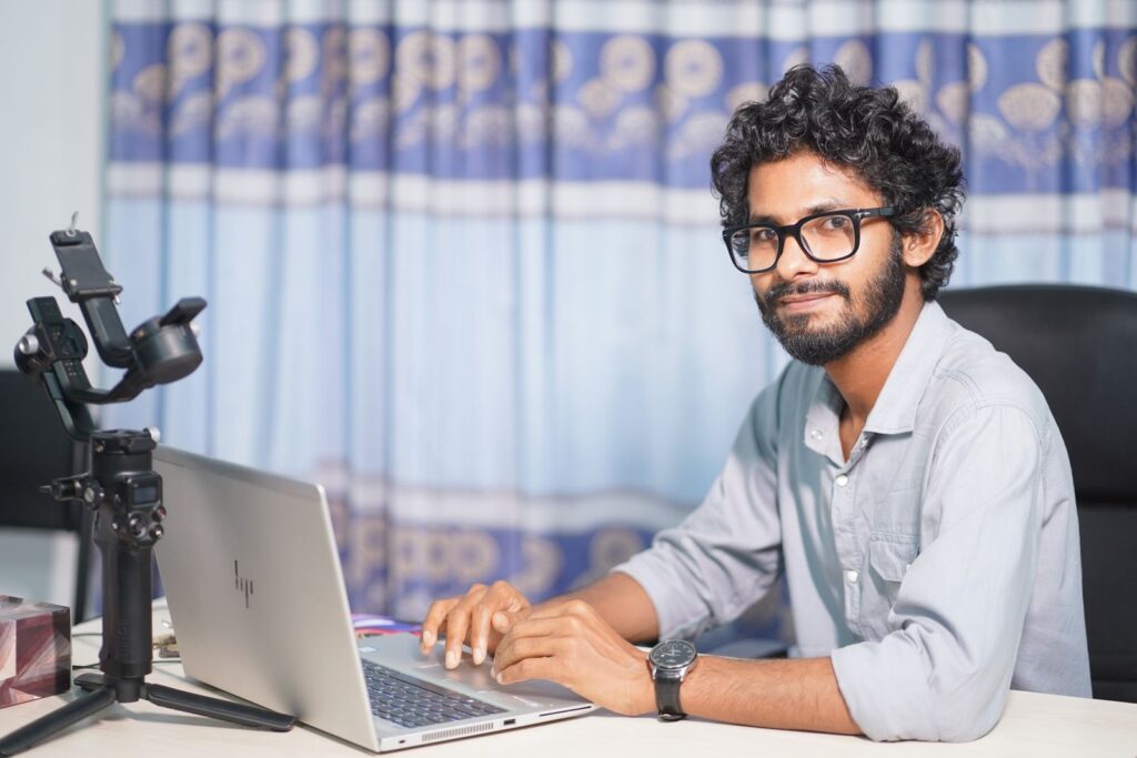 Web developer working on a laptop at a desk